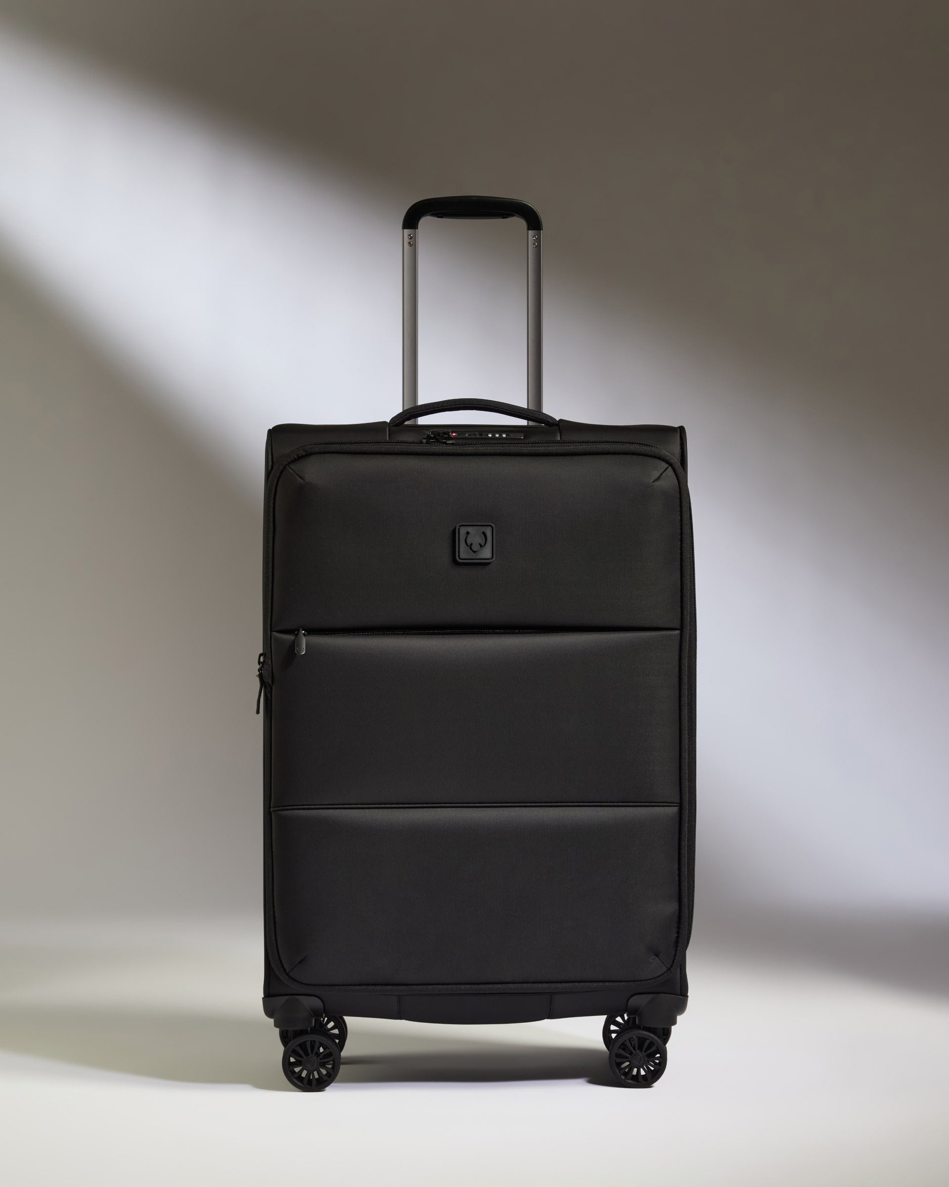 Lightest Medium Luggage in Black - Soft Stripe 2.0