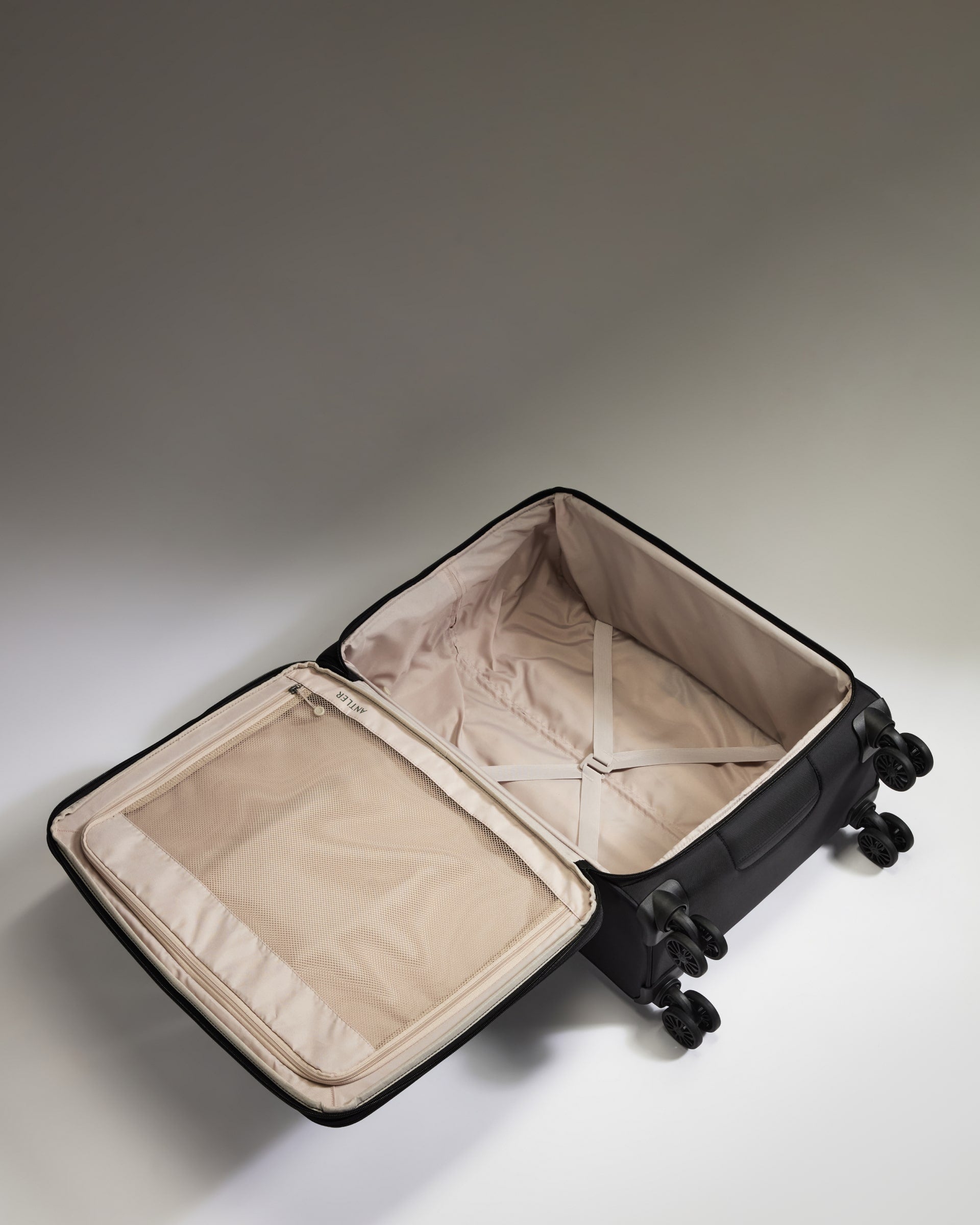 Lightest Medium Luggage in Black - Soft Stripe 2.0