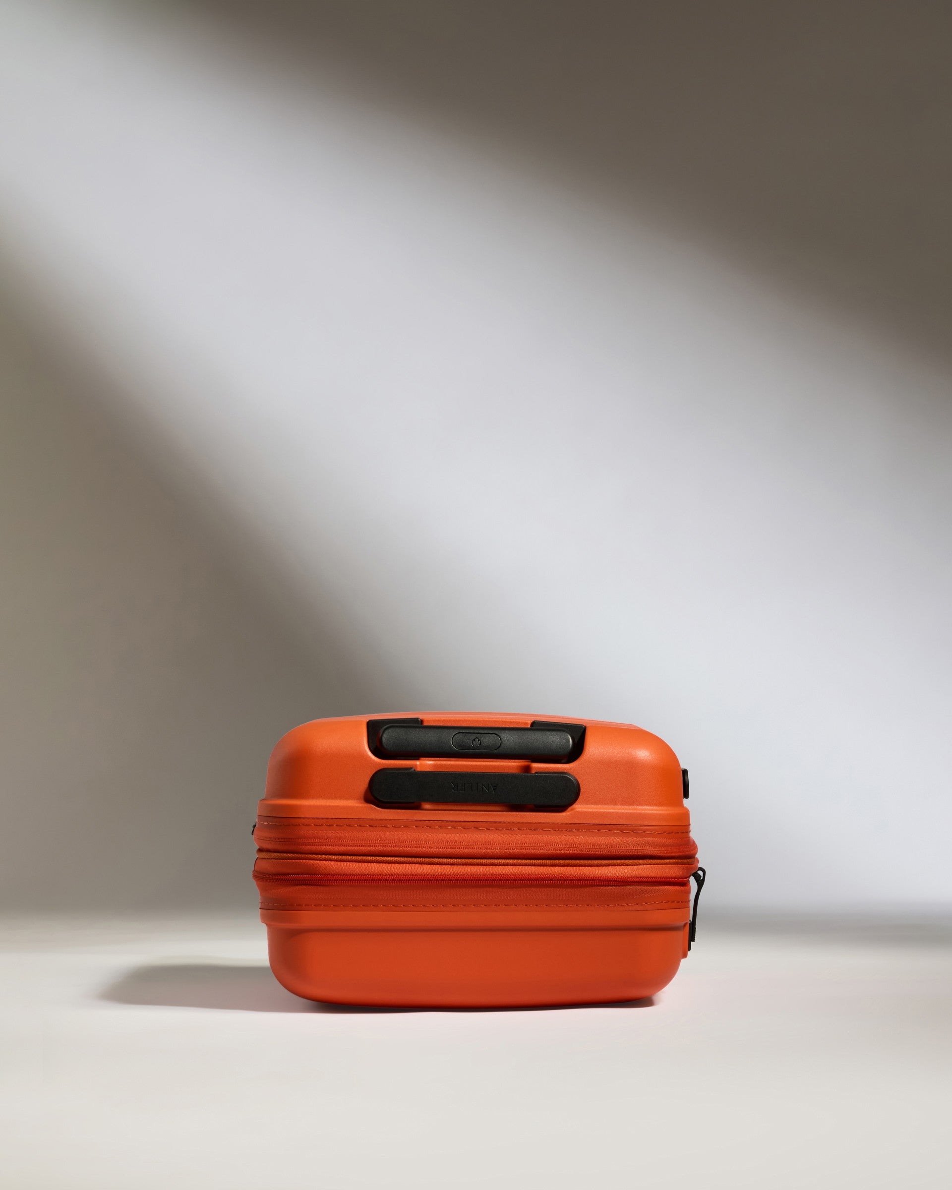 Expandable Carry-on Luggage in Ember Orange - Single Stripe