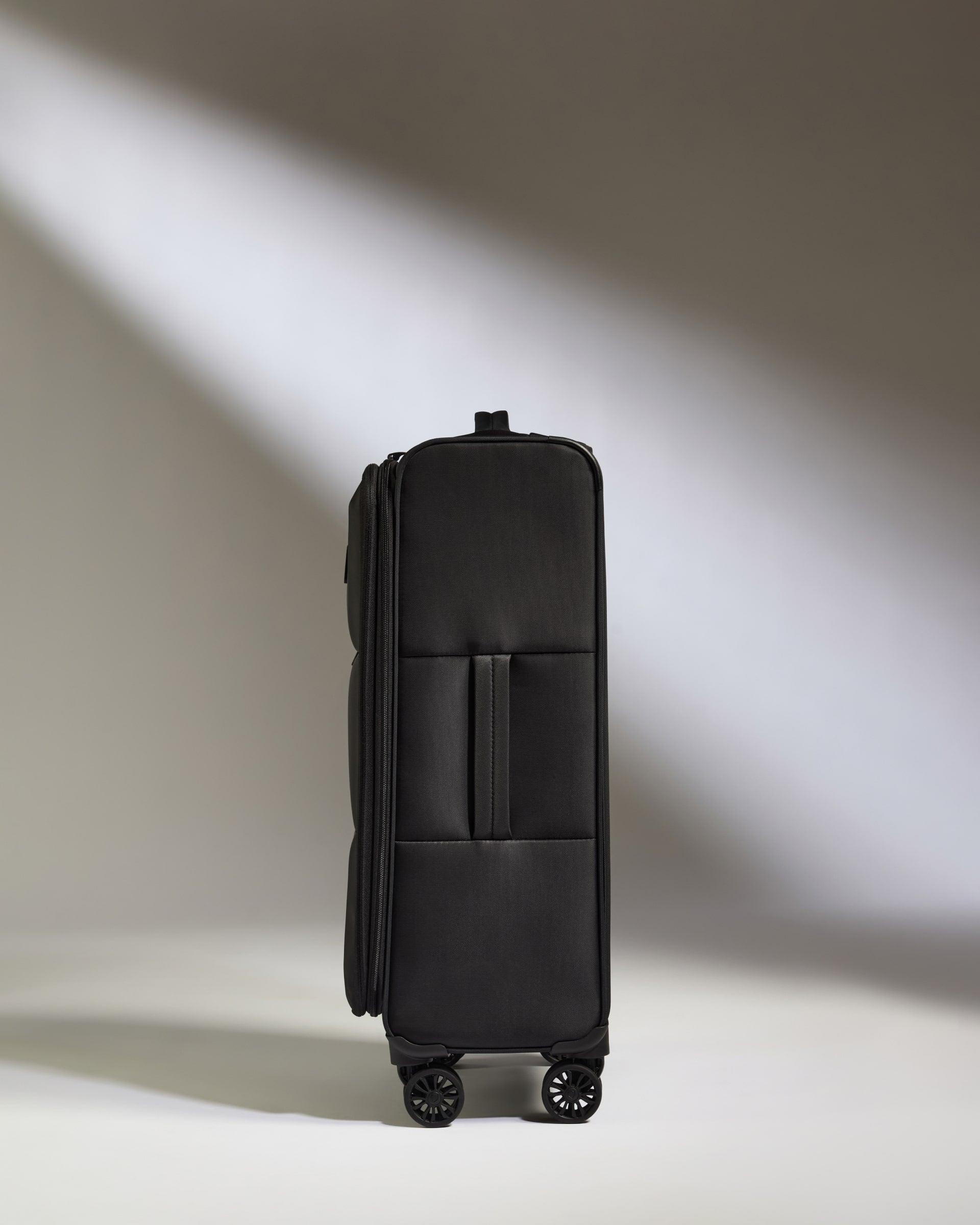 Lightest Medium Luggage in Black - Soft Stripe 2.0
