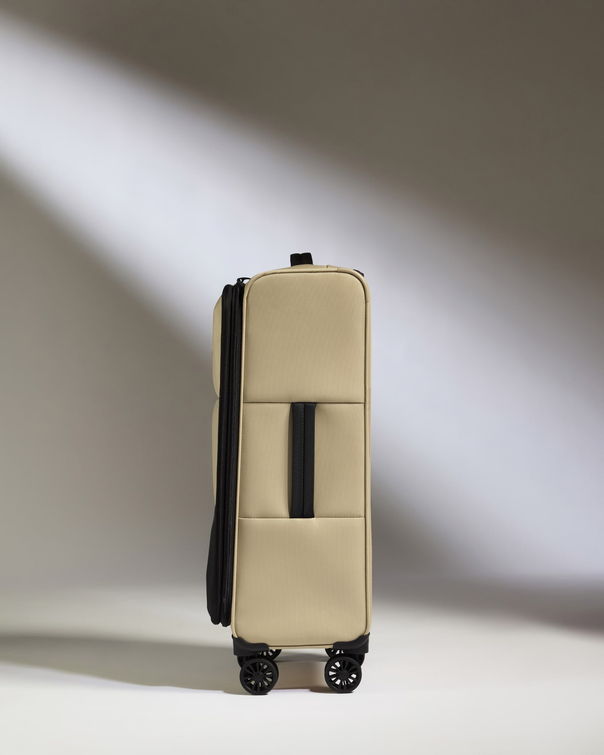 Lightest Medium Luggage in Sand - Soft Stripe 2.0