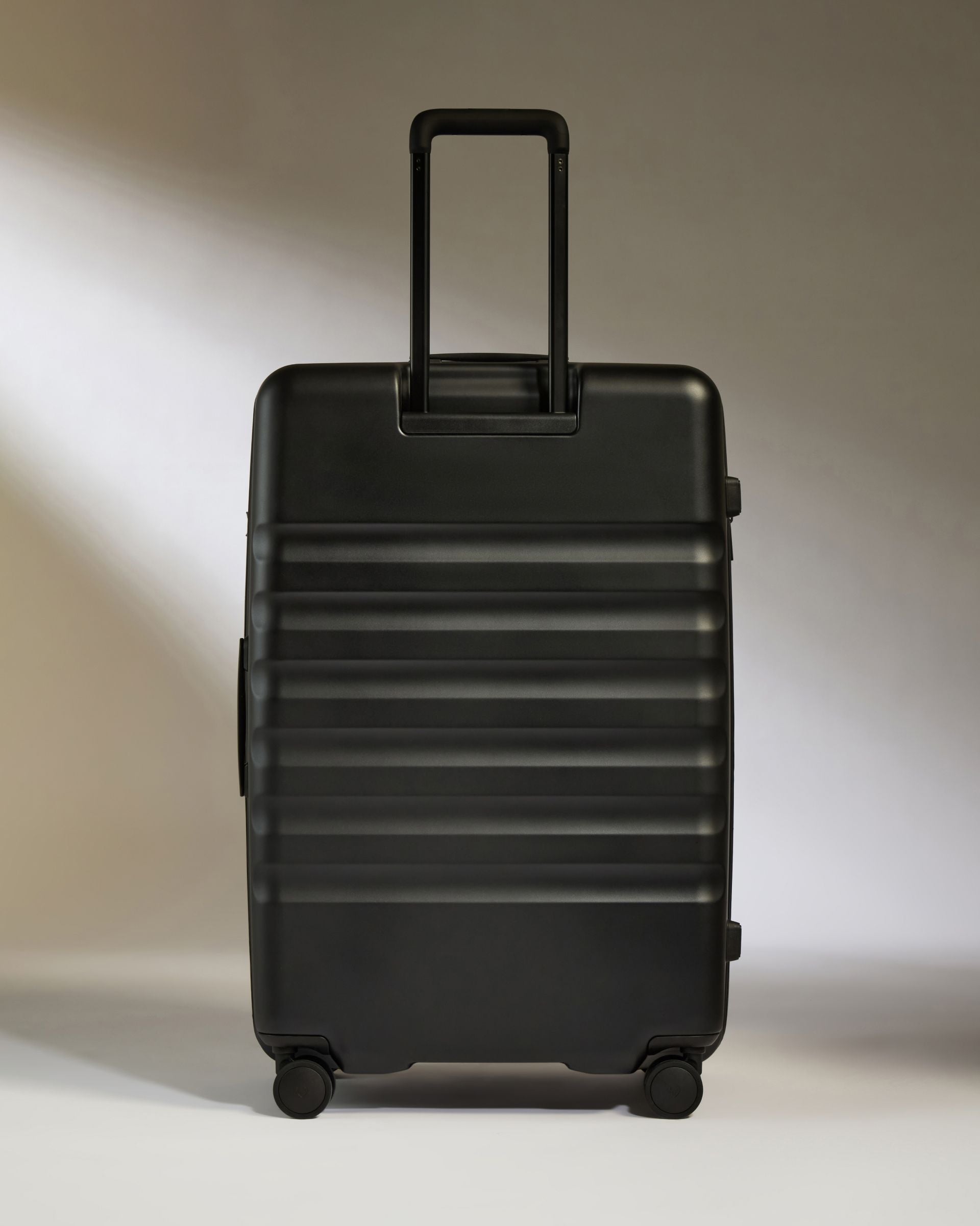 Large Luggage in Black - Icon Stripe