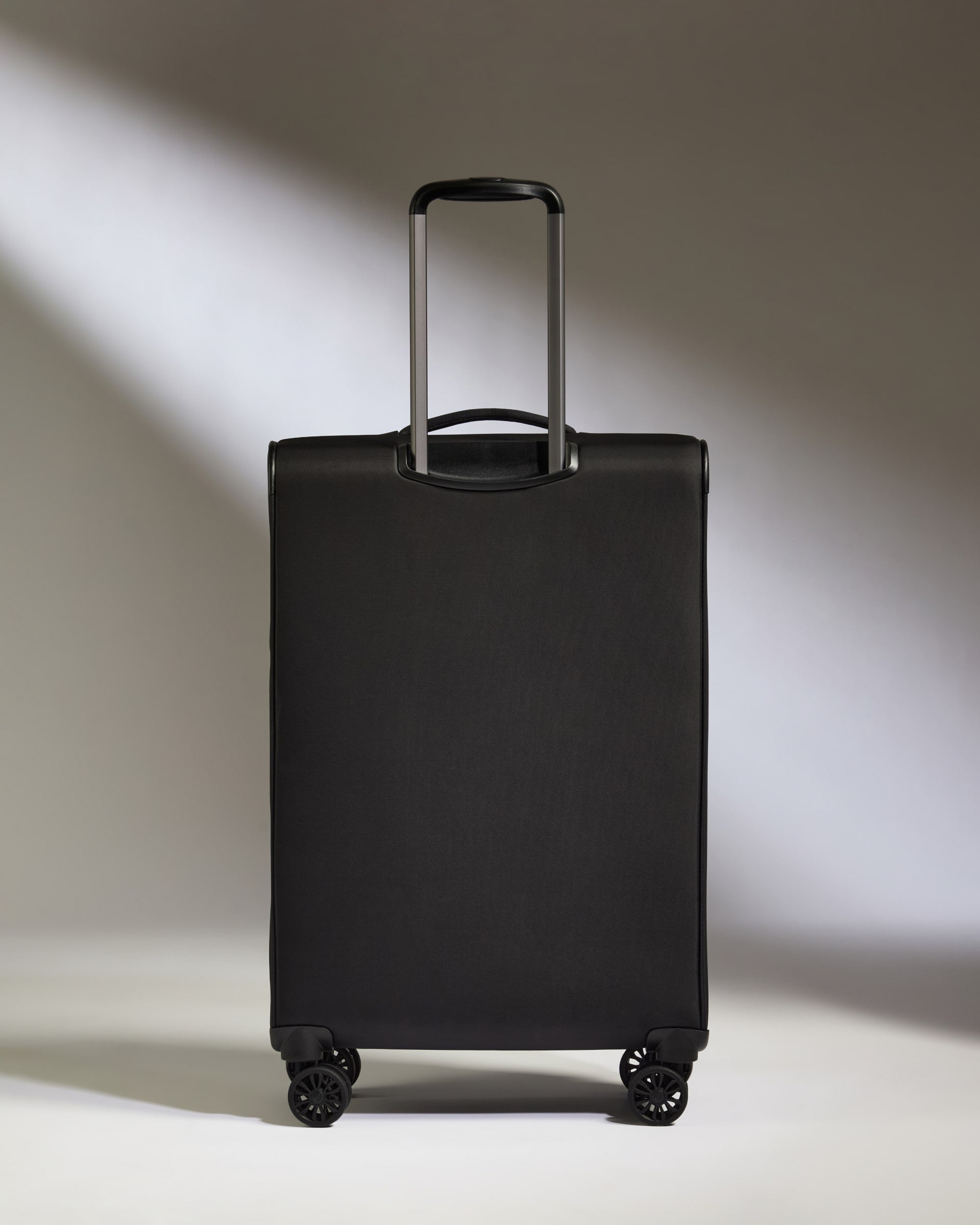Lightest Medium Luggage in Black - Soft Stripe 2.0