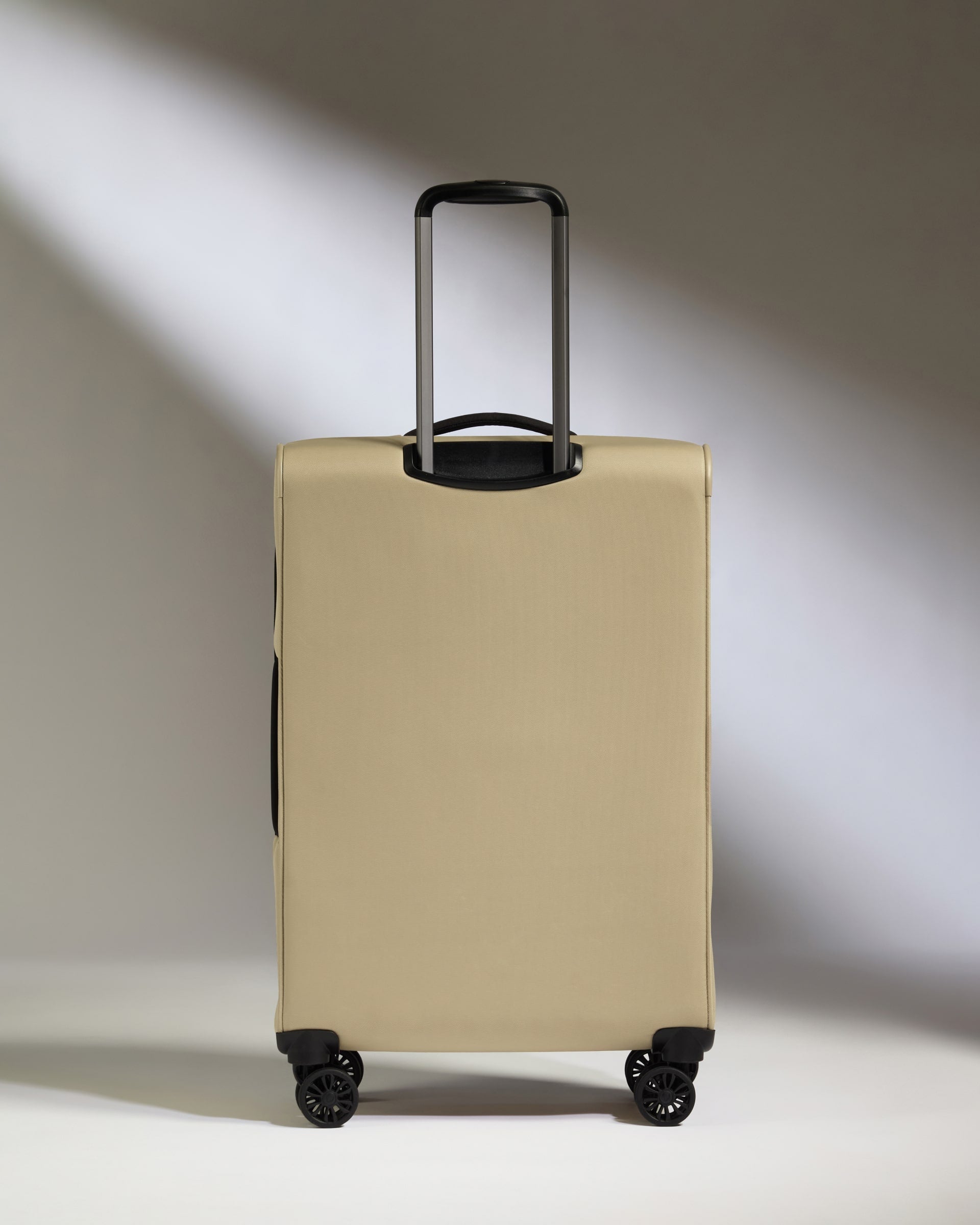 Lightest Medium Luggage in Sand - Soft Stripe 2.0